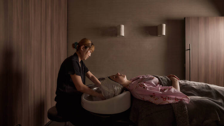 Relaxing scalp wash treatment at a head spa basin